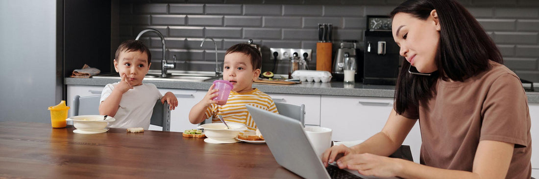 mother on the phone and kids eating