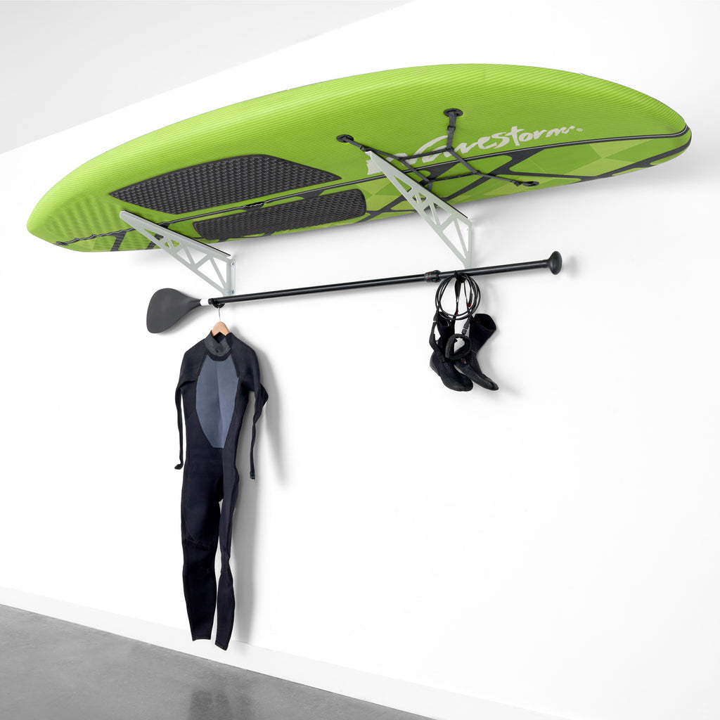 paddleboard, wetsuit and paddle on surboard rack