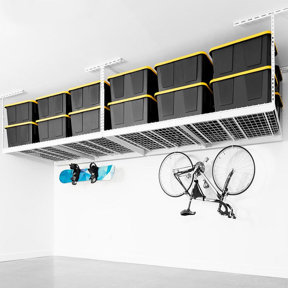 two overhead garage storage racks with deck hooks holding snowboard and bike
