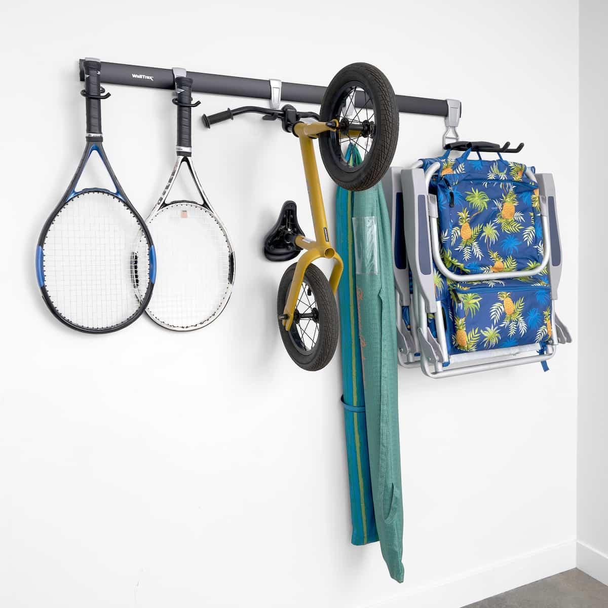 Garage wall track system holding various items