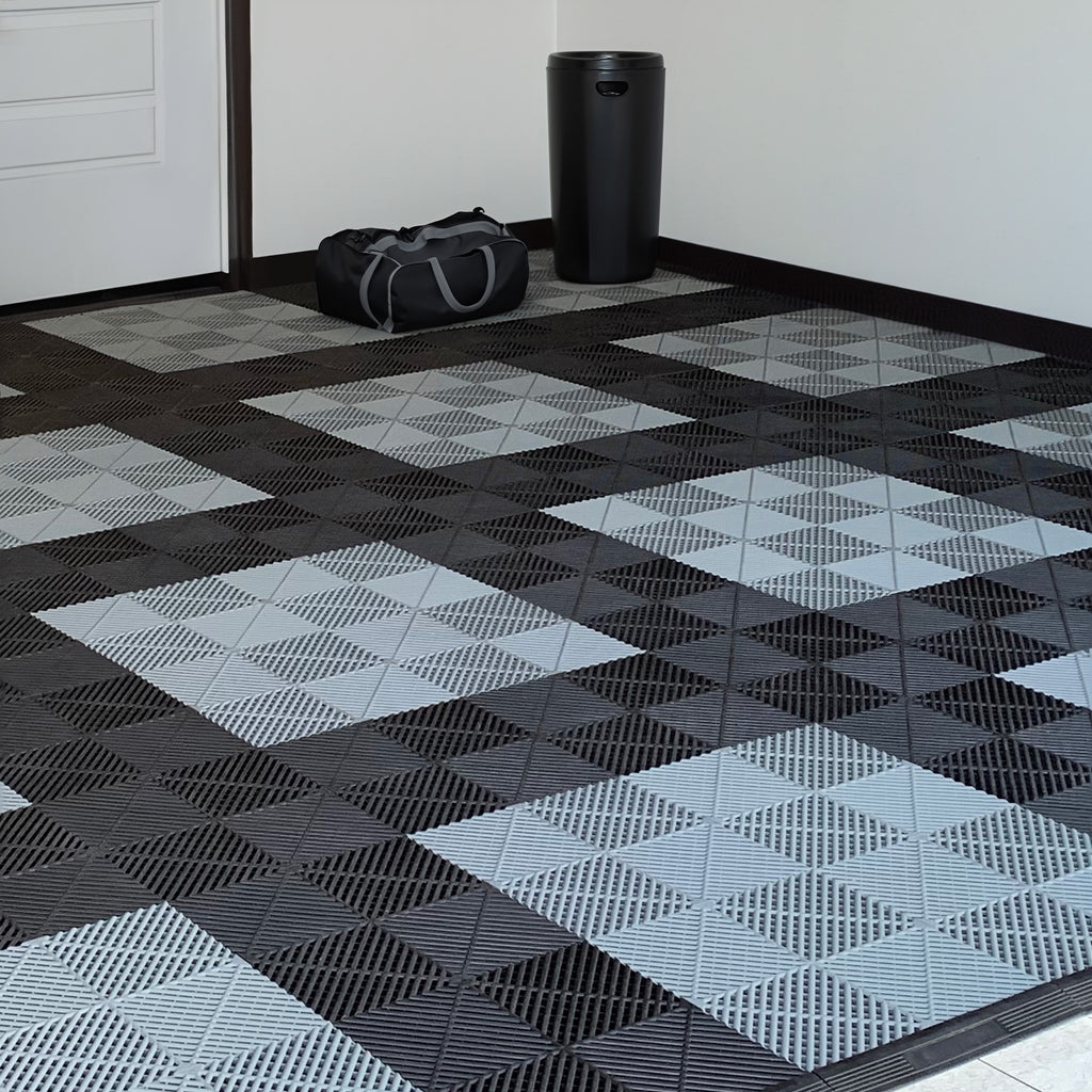 garage floor tiles in a pattern of black and gray tiles with a clean garage layout