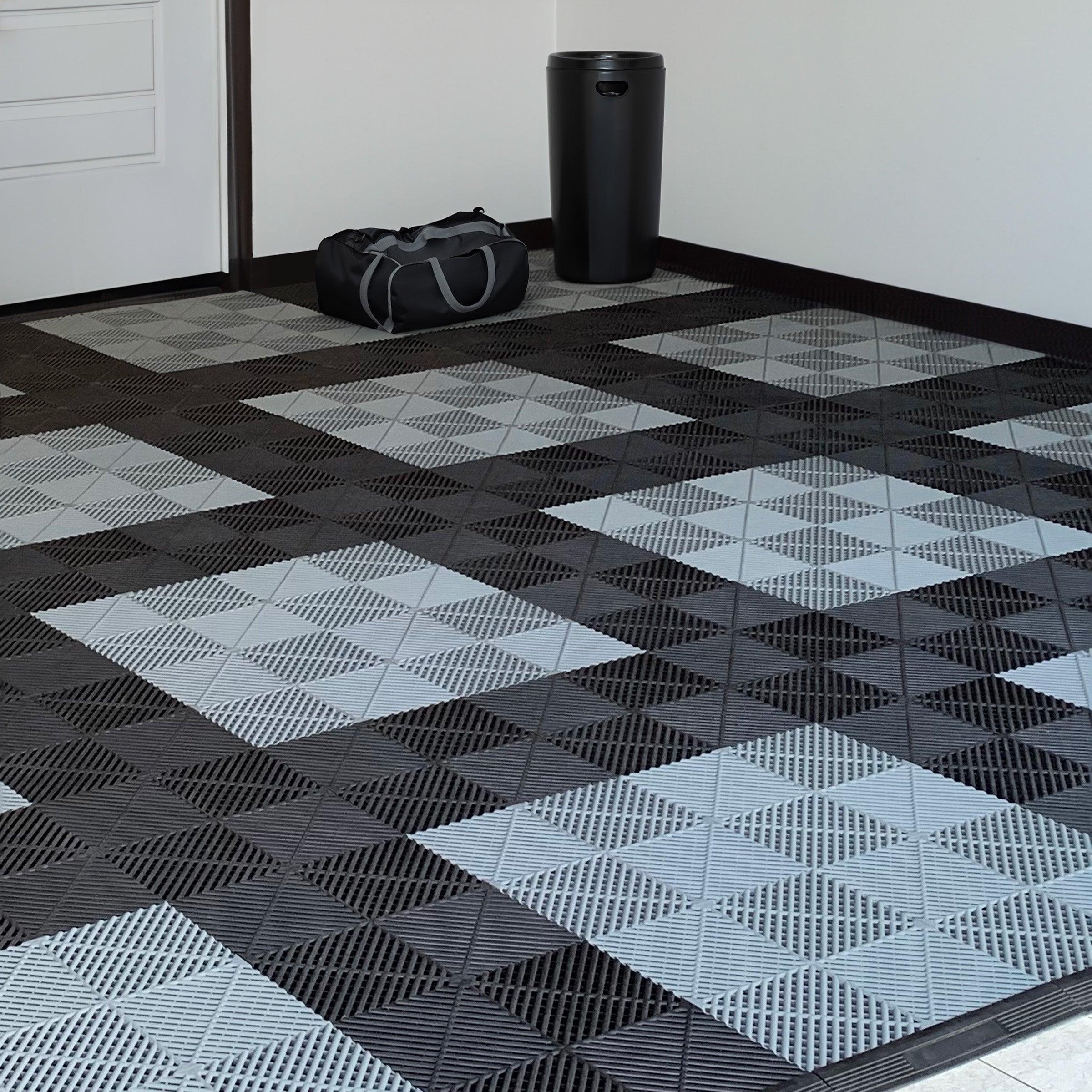 garage floor tiles in a pattern of black and gray tiles with a clean garage layout