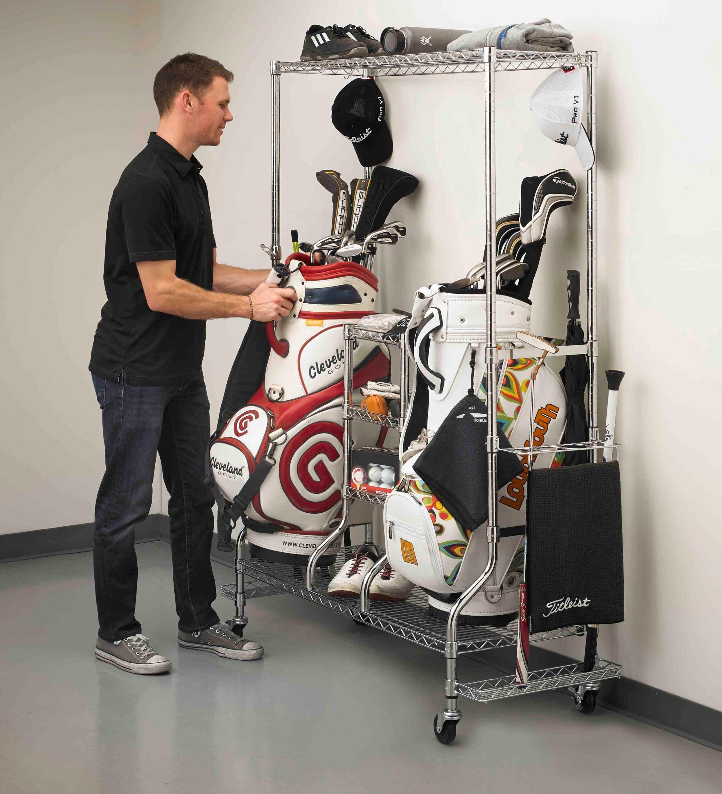 person removing golf bag from golf rack