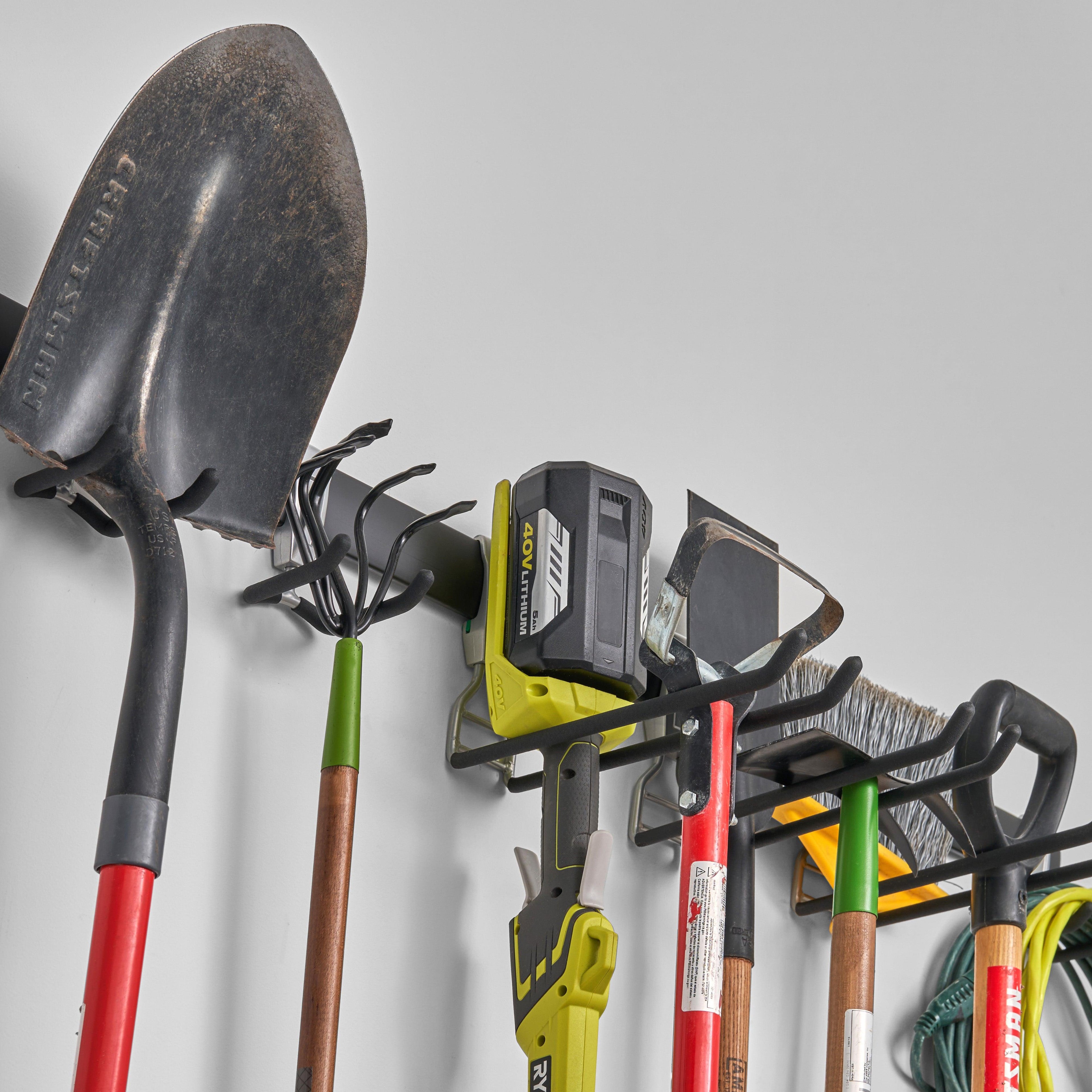 garage track system with gardening tools