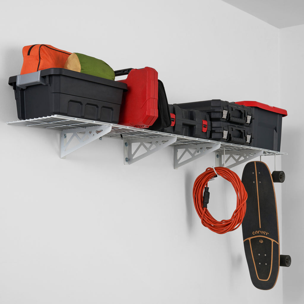 SafeRacks wall shelves with bins, tools, and skateboard hanging from storage hooks