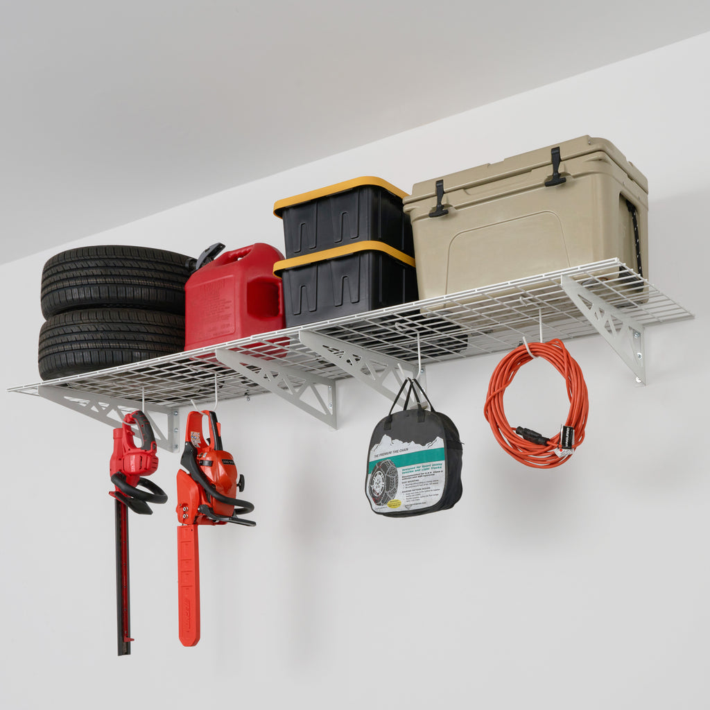 SafeRacks wall shelves with car tires, cooler, bines, and accessories hanging from hooks