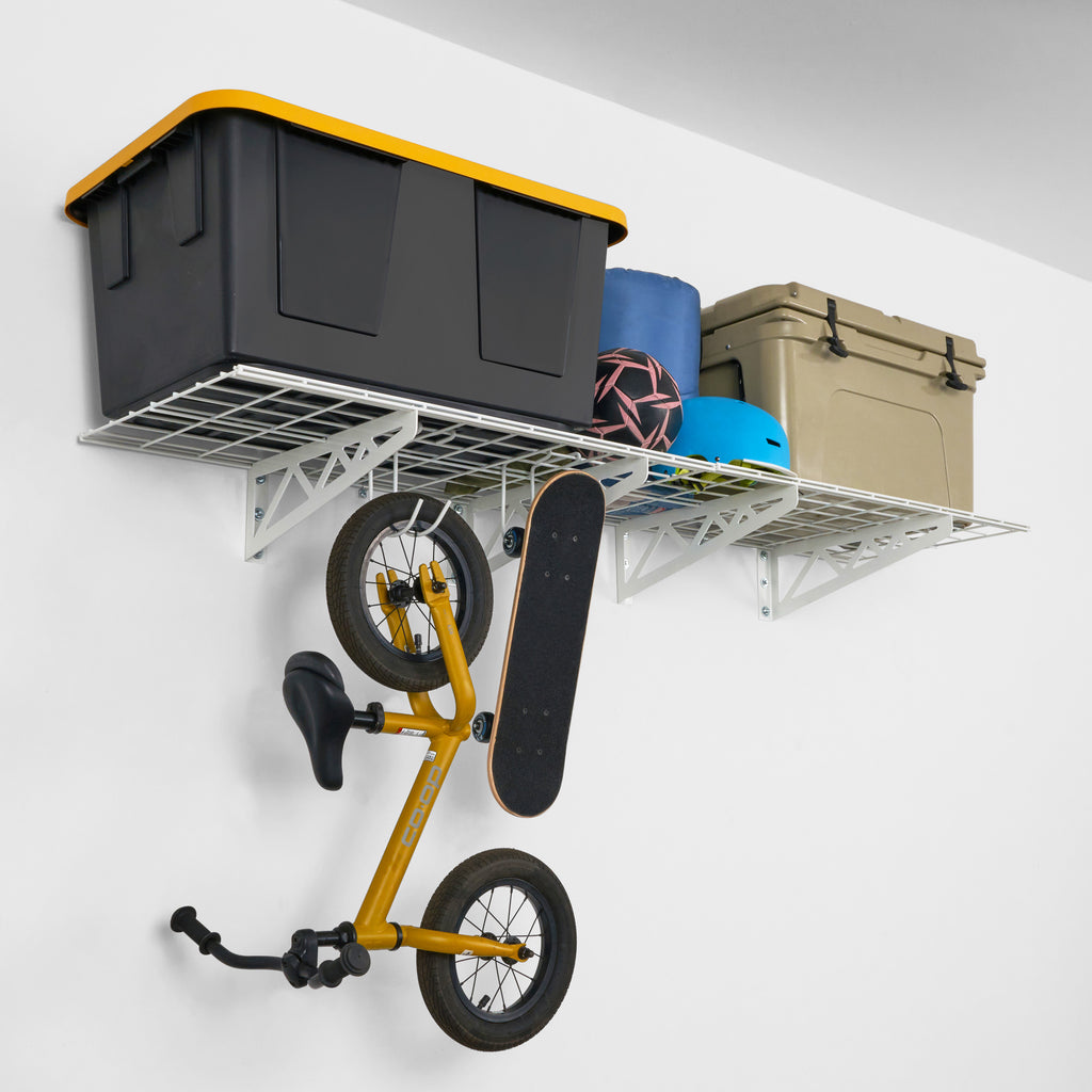 SafeRacks wall shelves with bin, cooler, helmet, and bike hanging from storage hooks