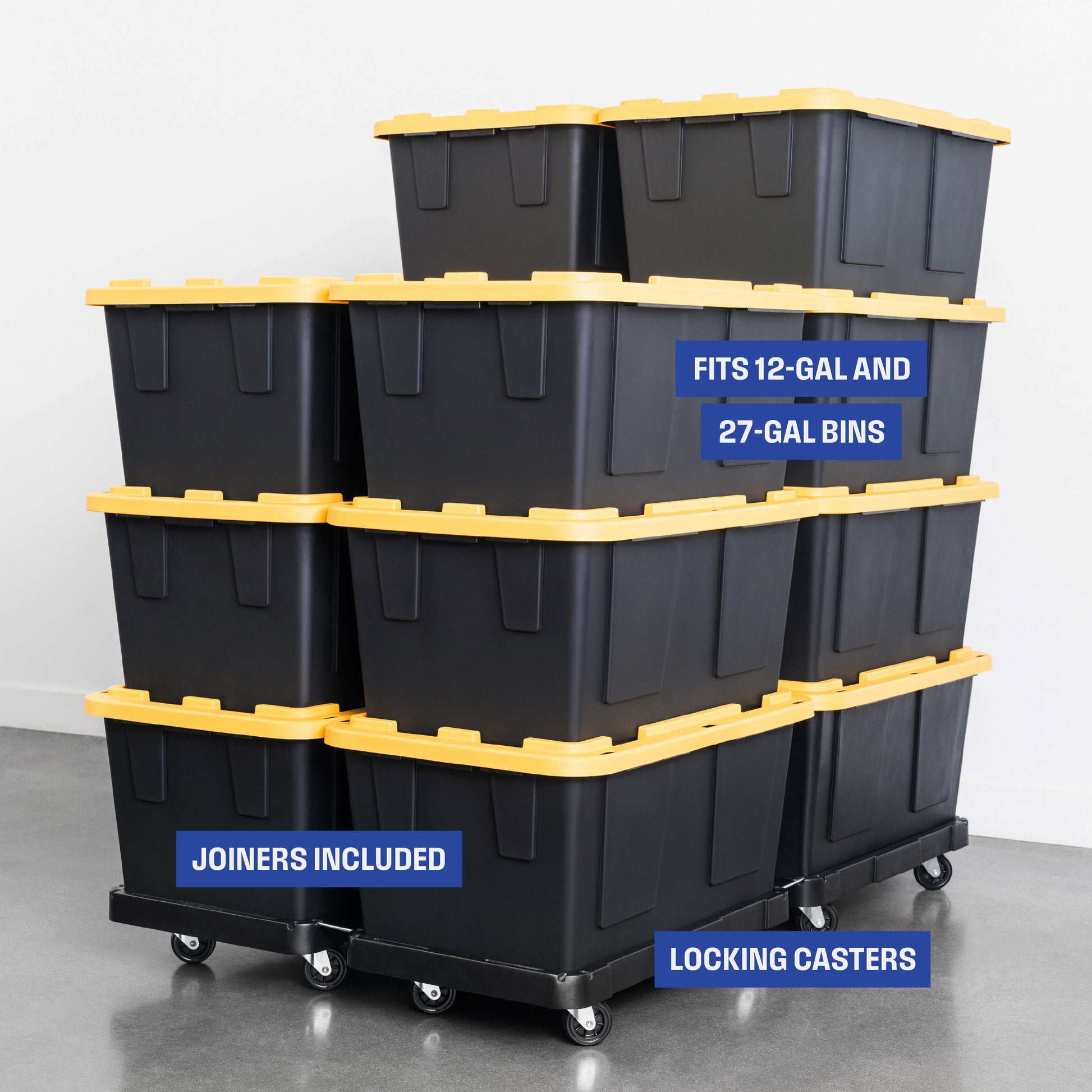 A group of 14 black plastic storage bins with yellow lids stacked on four black plastic bin dollies linked together. Overlay text highlights these features: "Joiners included, fits 12-gallon and 27-gallon bins, locking casters'