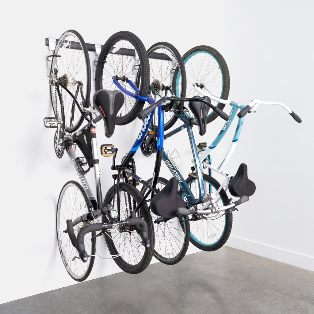 garage track system and adjustable bike hooks loaded with bicycles