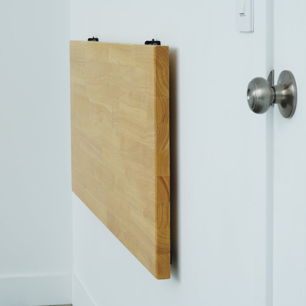 wall mounted folding table folded flat against the wall to save space