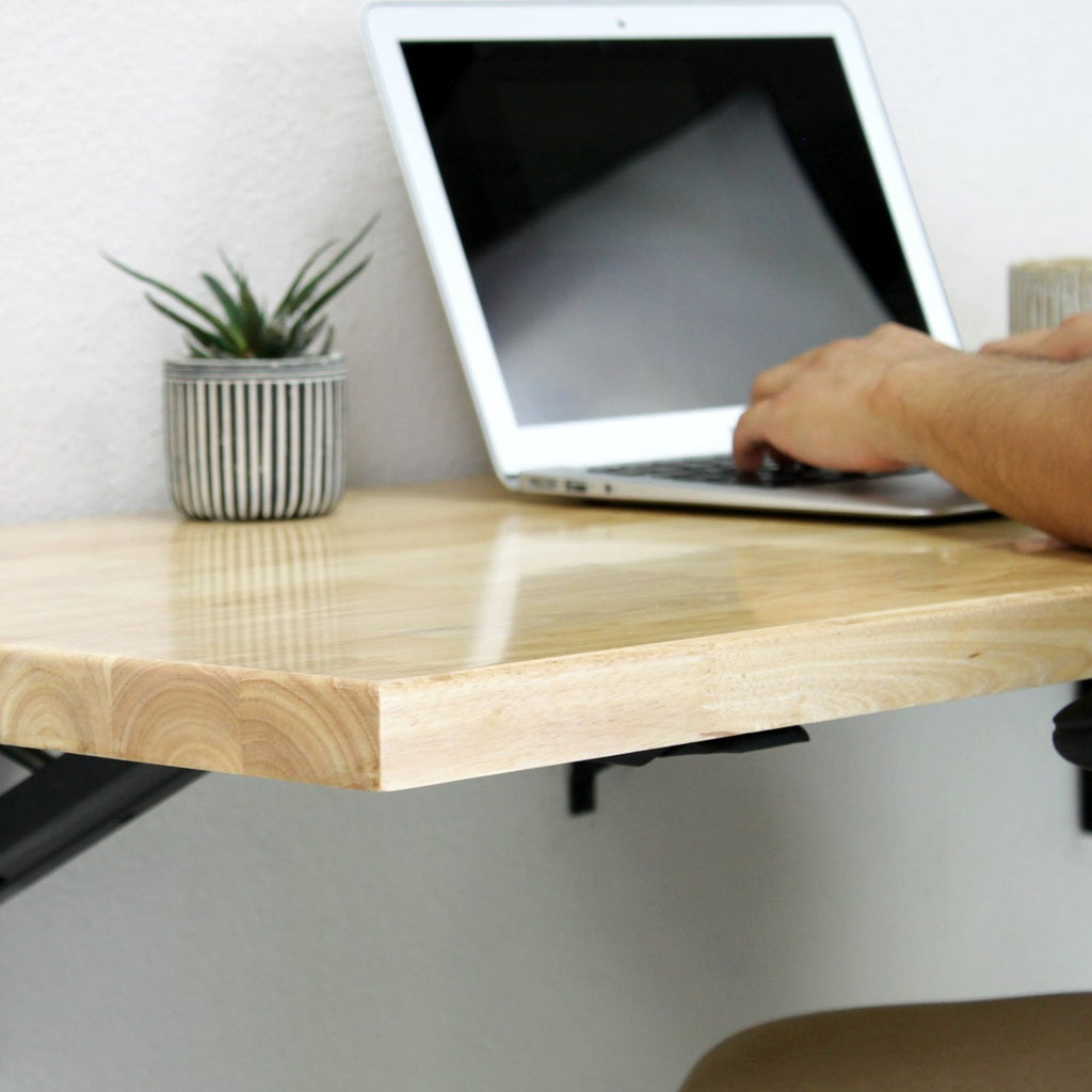 wall mounted folded table used as an office space 